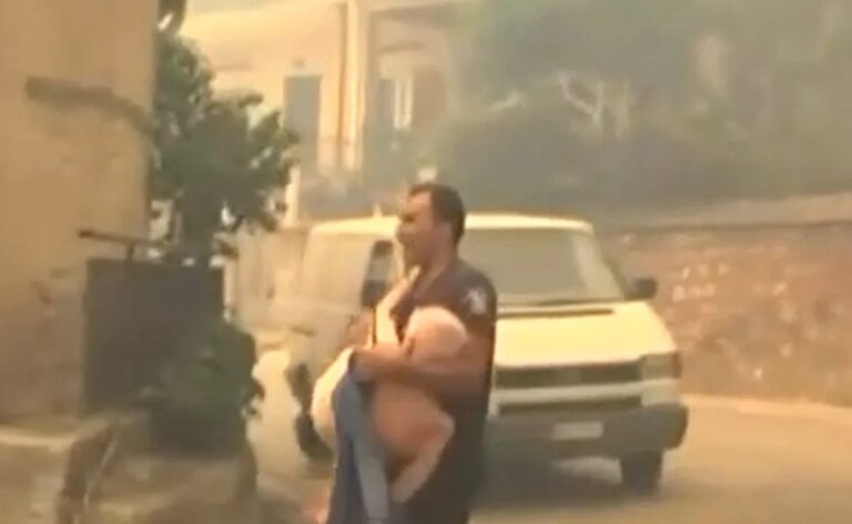 Συγκλονιστικό βίντεο από τη φωτιά στην Πάτρα: Αστυνομικός παίρνει αγκαλιά ηλικιωμένο για να τον σώσει